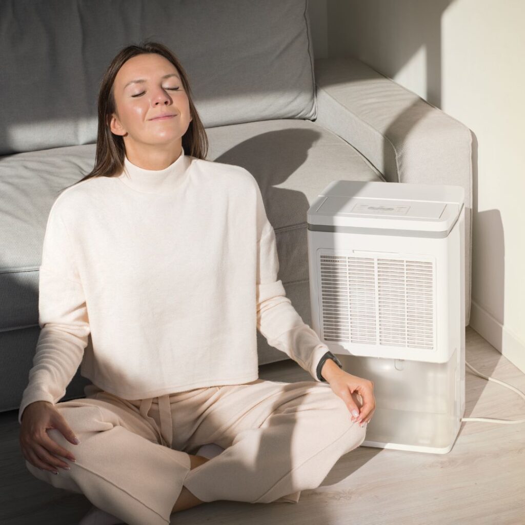 woman breathing in clear air after having her dirty air vents cleaned