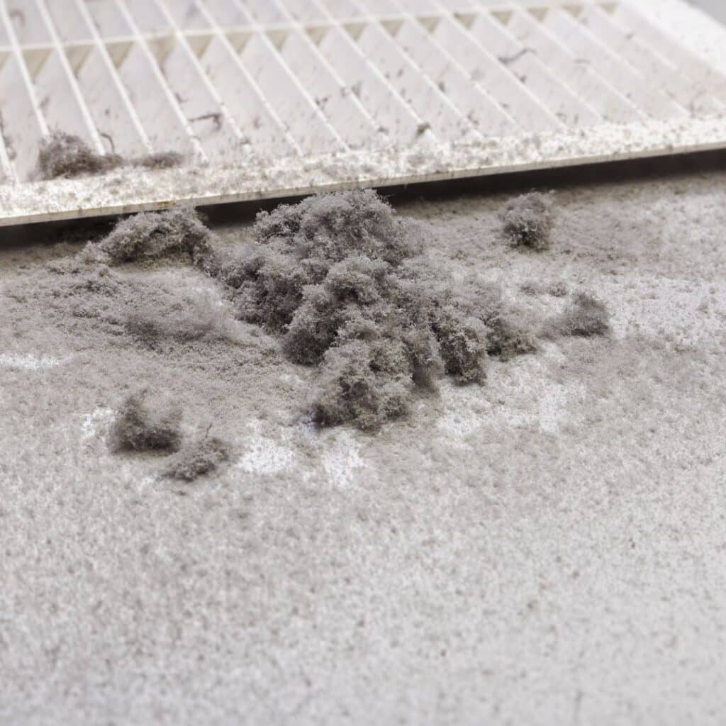 dust next to a vent showing that cleaning air ducts is necessary